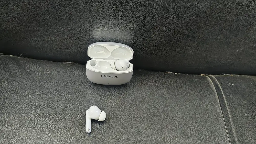 Nord Buds 4 Pro earbud with silicone ear tip next to the open case