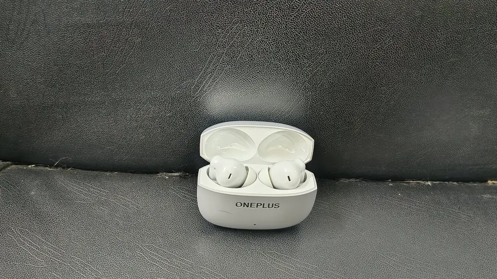 Nord Buds 4 Pro earbuds inside the open charging case